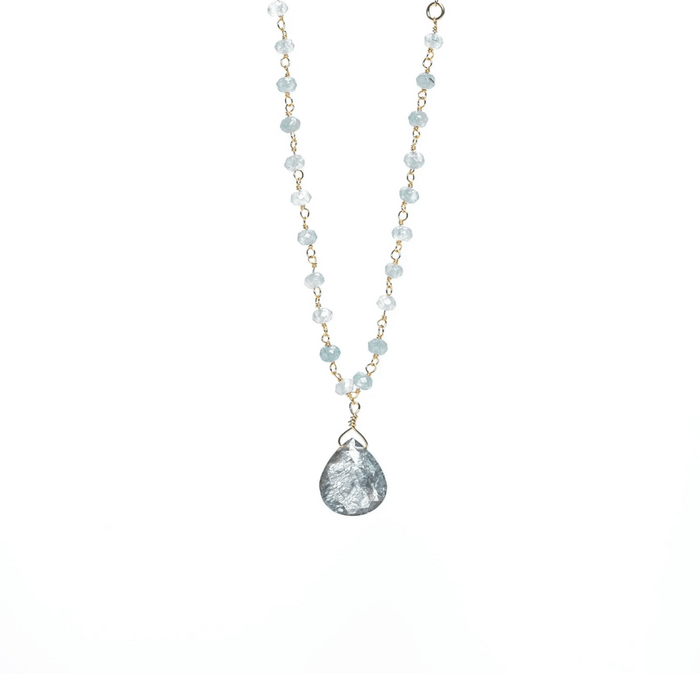 Delicate necklace featuring light blue beads and a teardrop-shaped pendant with a textured surface, designed as the Alice Rosary Necklace | Liv & B.