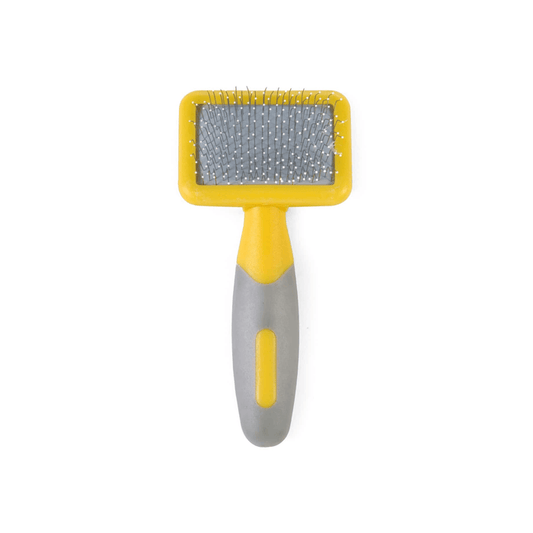 White background with a small animal Ancol yellow slicker brush with white tipped metal bristles and grey grips on the handle.