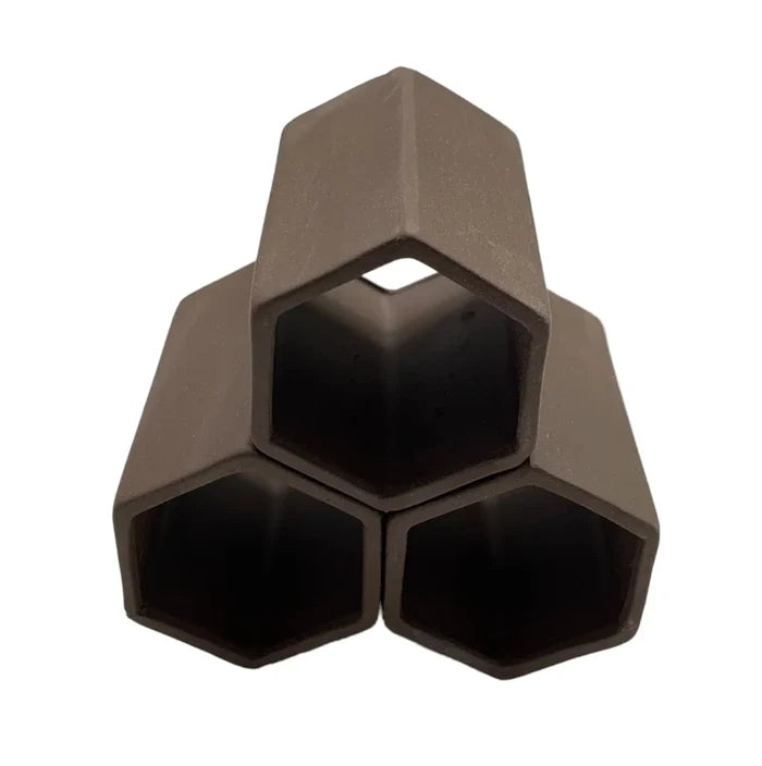 Aquarium triple hexagon cave with three interlocking matte dark brown hexagonal tubes forming a triangular structure