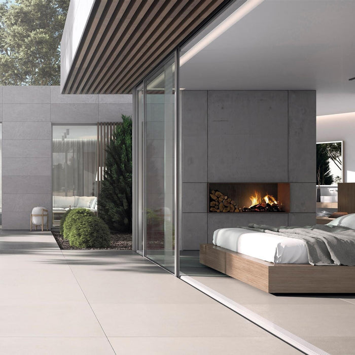 Modern bedroom with a view of a pool and outdoor area with beige paving