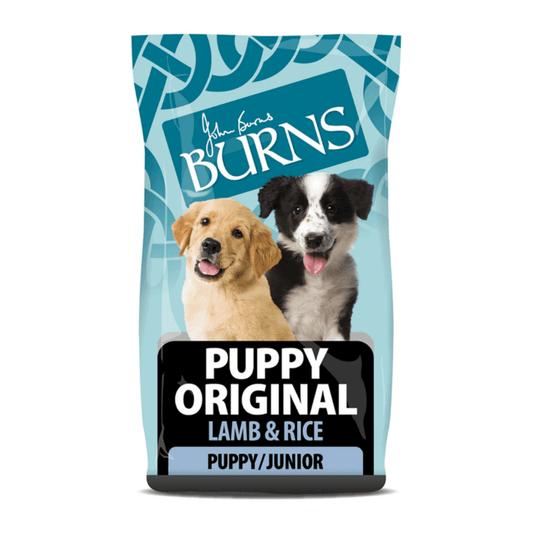 White background with a bag of Burns Original Lamb dry puppy food, pictured on the bag is a Border Collie and Labrador puppies below is text 'Original Lamb & Rice, Puppy/Junior'.