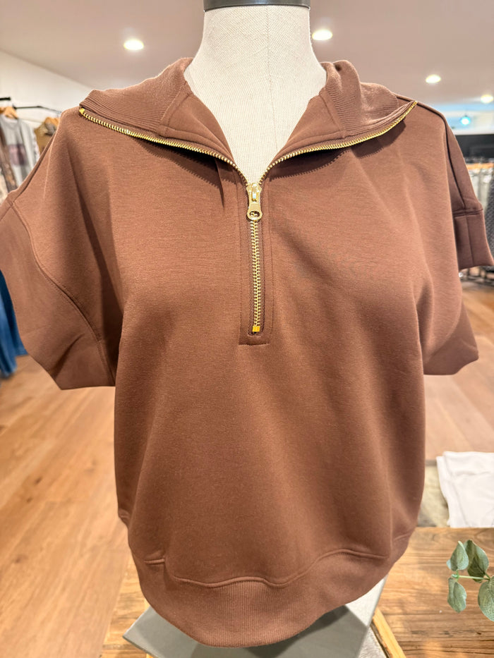 Cocoa 1/4 zip T-shirt on mannequin, front quarter zip
