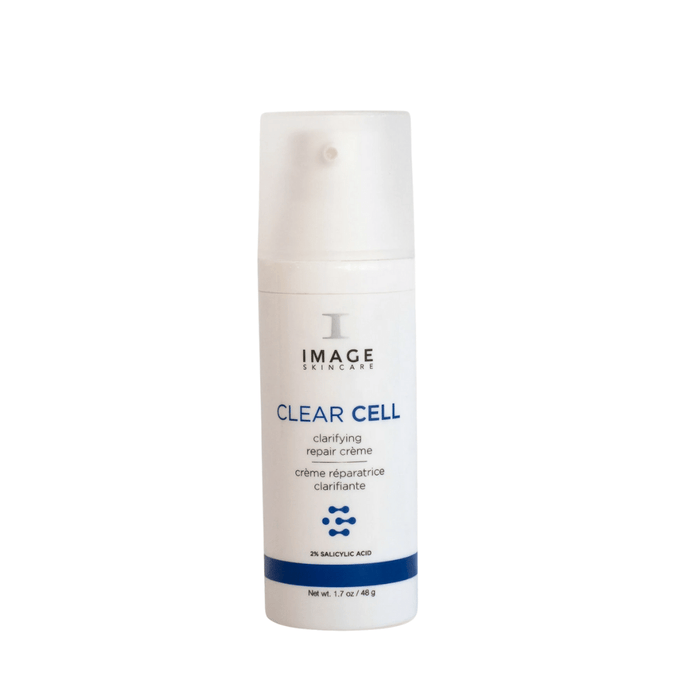 Bottle of CLEAR CELL clarifying repair crème | IMAGE Skincare, a white skincare product with blue accents designed for skin repair and clarity, containing 2% salicylic acid.