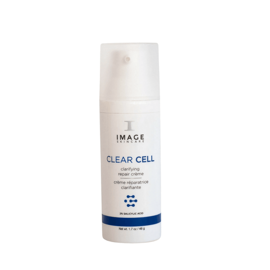 Bottle of CLEAR CELL clarifying repair crème | IMAGE Skincare, a white skincare product with blue accents designed for skin repair and clarity, containing 2% salicylic acid.