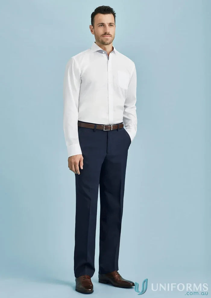 Man in white shirt and navy pants showcasing Cool Stretch Flat Front Pant for stylish workwear