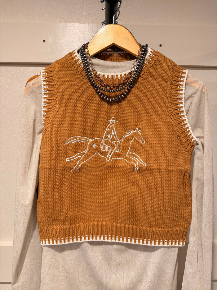Rust sleeveless sweater vest with cowboy-on-horse knit graphic and scoop neck