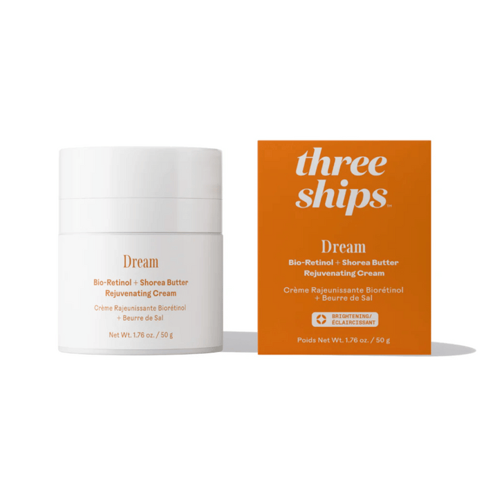 White jar and bright orange box of Dream Bio-Retinol + Shorea Butter Rejuvenating Cream | Three Ships, a skincare product for brightening and rejuvenation.