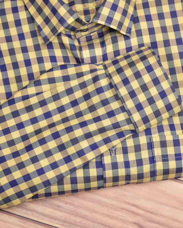 Men's linen shirt with blue-and-yellow check print and visible button cuffs