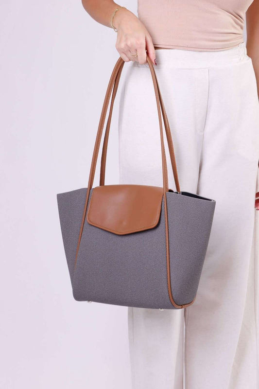 Grey tweed-style tote bag with brown vegan leather trim, front flap pocket, shoulder handles