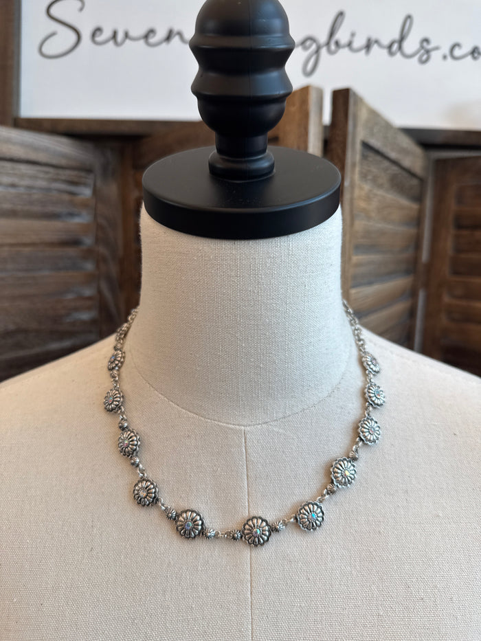 Floral crystal necklace with round blue gems and gold-tone flower links