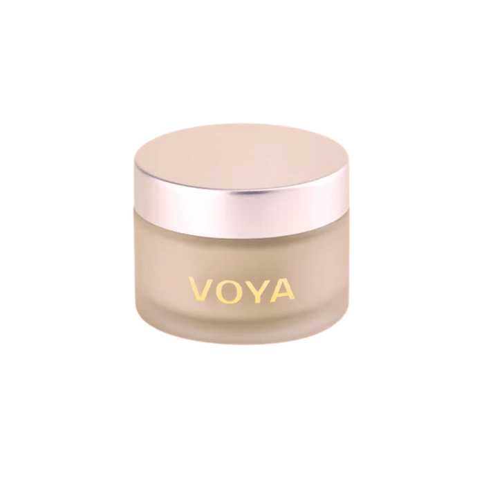 Jar of Get Glowing Illuminating Clay Mask | VOYA, a skincare product in a frosted container with a metallic lid, designed to enhance skin radiance.