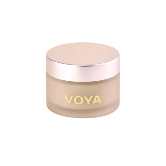 Jar of Get Glowing Illuminating Clay Mask | VOYA, a skincare product in a frosted container with a metallic lid, designed to enhance skin radiance.