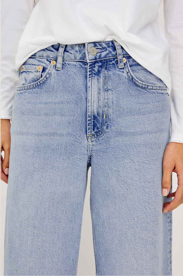 Getty Wide Leg Jean in Light Stretch Denim With High-Rise High-Waisted Fit, Button Fly, and 5-Pocket Styling in Jasper Colorway - Lower Body Front View Featured on Model
