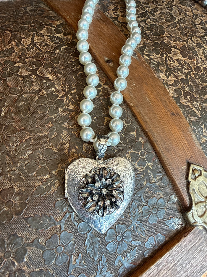 Heart locket pendant necklace with white pearl beads and ornate heart charm