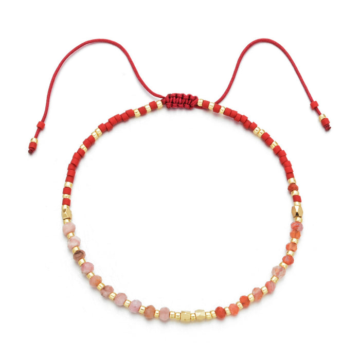 Japanese Handmade Bead Bracelets | Live Love Spa featuring a delicate adjustable red cord with alternating red, pink, and gold beads, ideal for wellness and style.