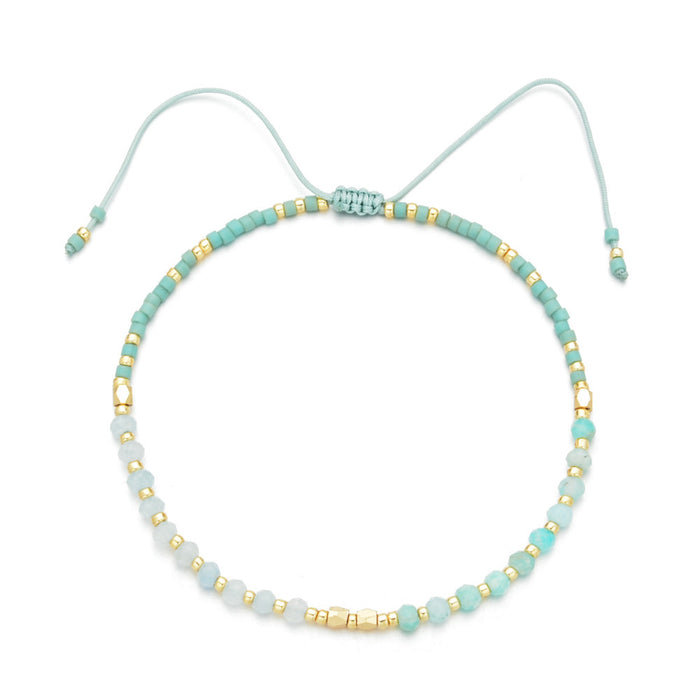 Delicate turquoise and gold beaded bracelet with adjustable cord, showcasing artisanal craftsmanship in Japanese Handmade Bead Bracelets | Live Love Spa.