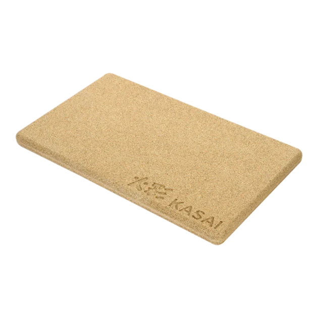 A beige rectangular heat mat with the brand 'KASAI' embossed on it.