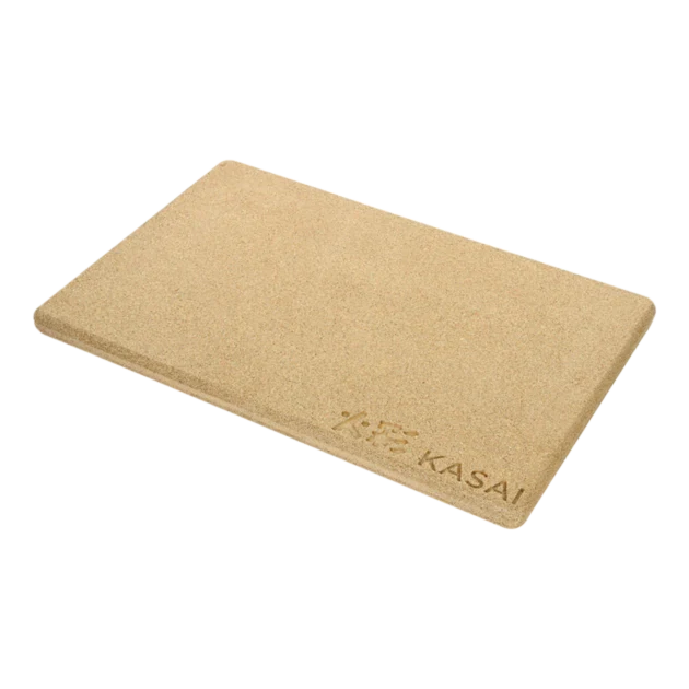 A beige rectangular heat mat with the brand 'KASAI' embossed on it.