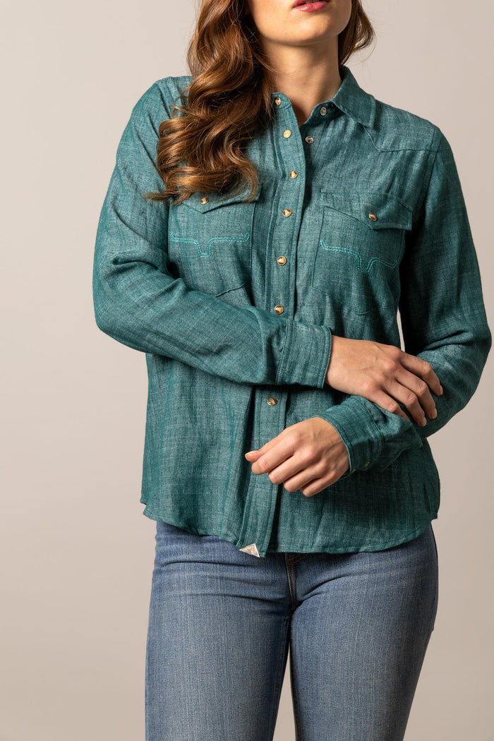Dark teal snap-front button-up shirt with chest pockets, long sleeves