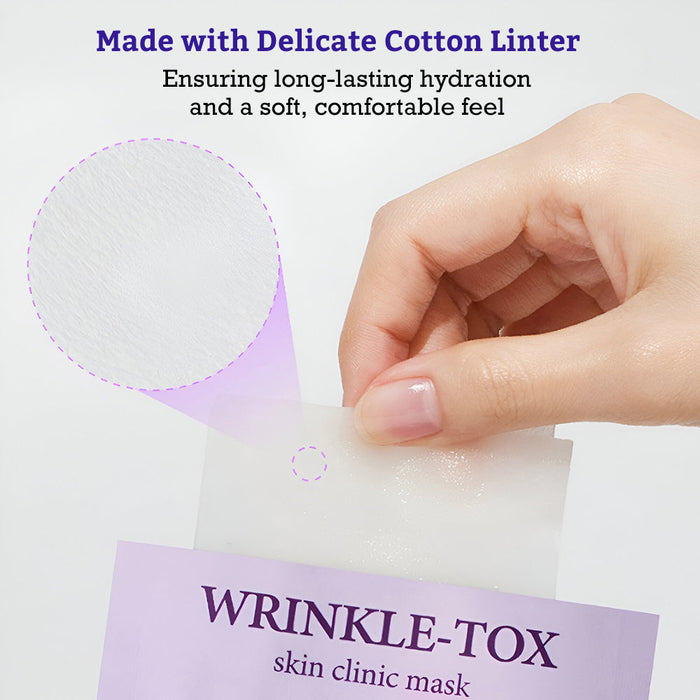 A hand holding a delicate cotton linter sheet being pulled out from a lavender pouch labeled Leaders Skin Clinic Mask Wrinkle-Tox | Leaders, highlighting the soft texture and hydrating qualities of the skincare mask.