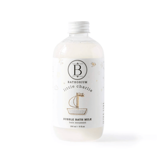 Clear bottle of little charlie™ Bubble Bath Milk | Bathorium with white cap and minimalistic label featuring a small sailboat illustration, designed for skincare and body care.