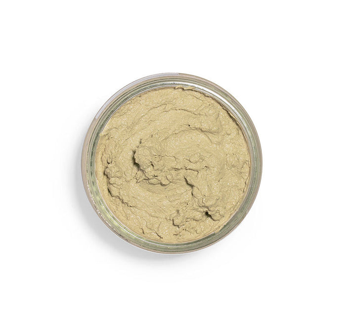 Top view of a creamy green facial mask in a clear jar, showcasing the smooth texture of Matcha Purity™ Calm & Clear Purification Mask | FarmHouse Fresh for skincare.