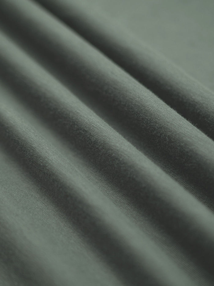 StratuSoft: The fabric that flexes with your every step # Mercury Green V-Neck StratuSoft Fabric Detail | Fresh Clean Threads