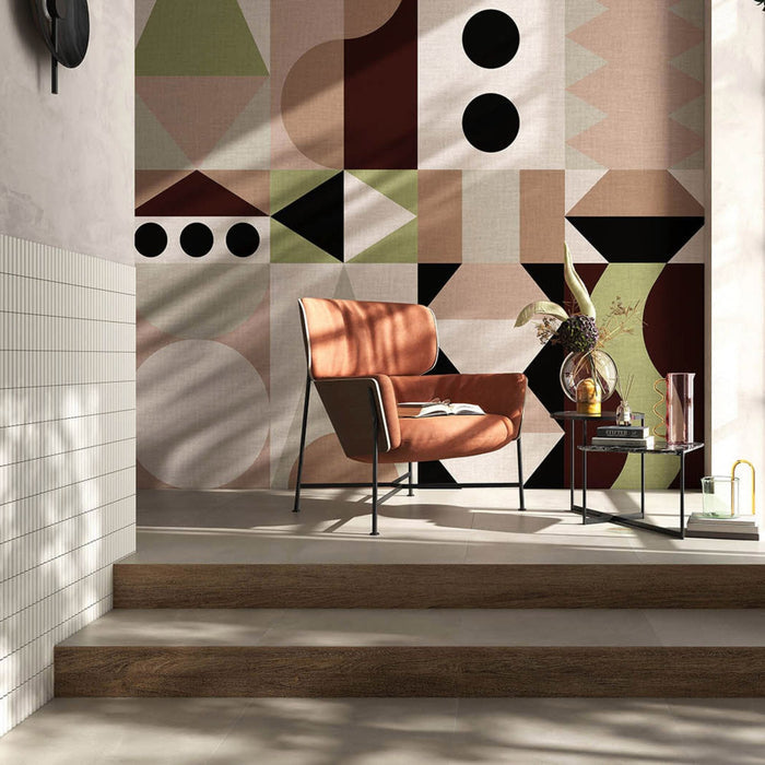 Armchair with patterned wall in the background and white fluted wall tiles on the left