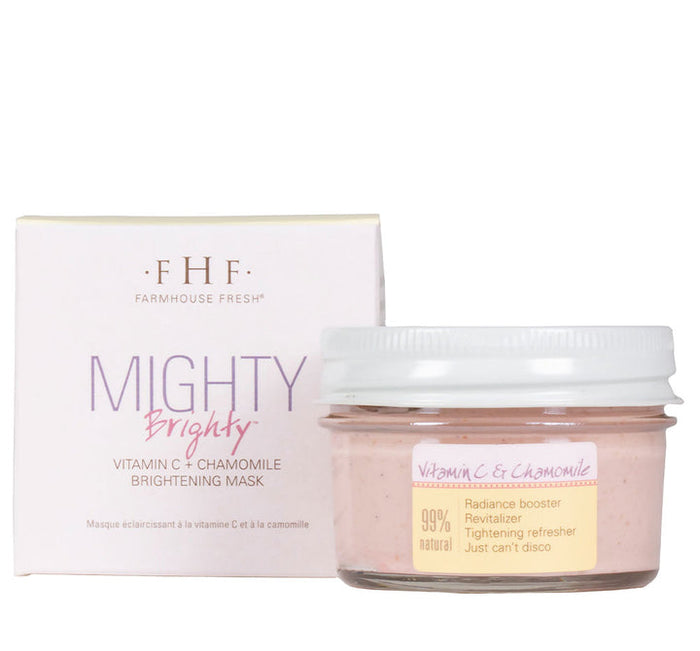 Mighty Brighty™ Vitamin C + Chamomile Brightening Mask | Farmhouse Fresh in a clear jar with a white lid alongside its white and lavender box, promoting radiance and natural skincare benefits.