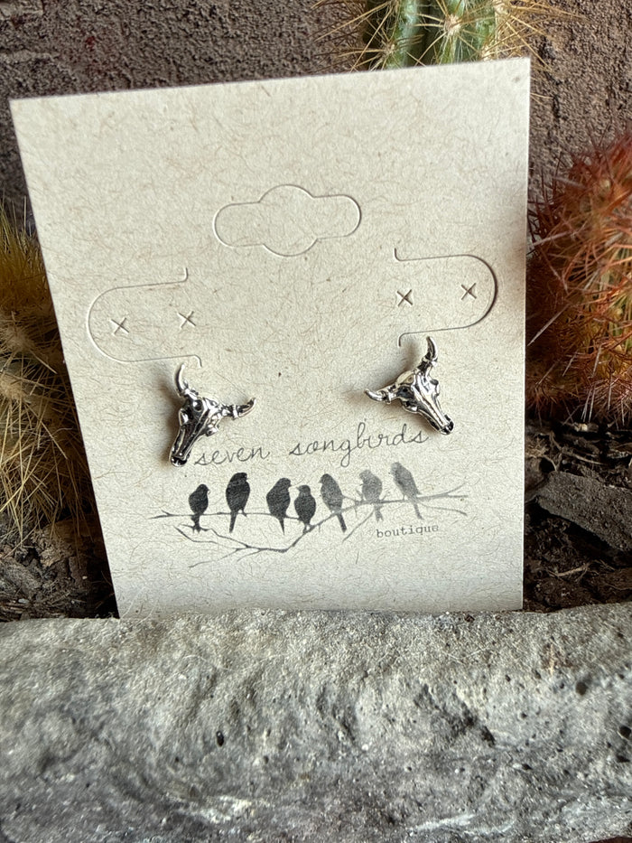 Mini cow skull stud earrings, two small silver-tone cow skull studs on card