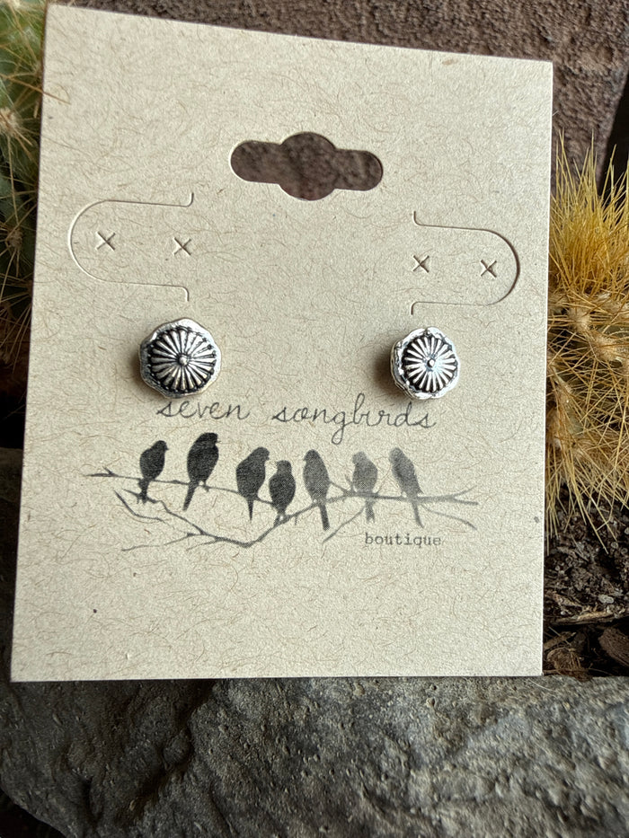 Mini stud earrings with silver sunburst round studs and dark center details.