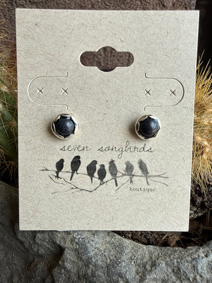 Mini stud earrings with round black stone domes in silver-tone bezels.