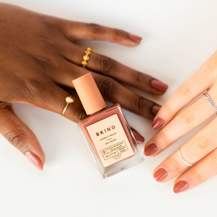 Hands wearing BKIND Arizona polish – Calgary non-toxic nude manicure in warm brown-pink for everyday elegance.