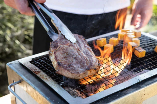 Meat being cooked over Kasai Spare mesh on top of Kasai grill.