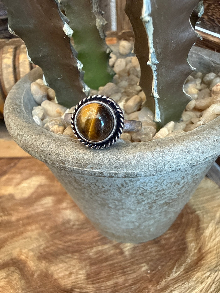 Adjustable brass ring with round golden tiger-eye stone bezel and beaded edge