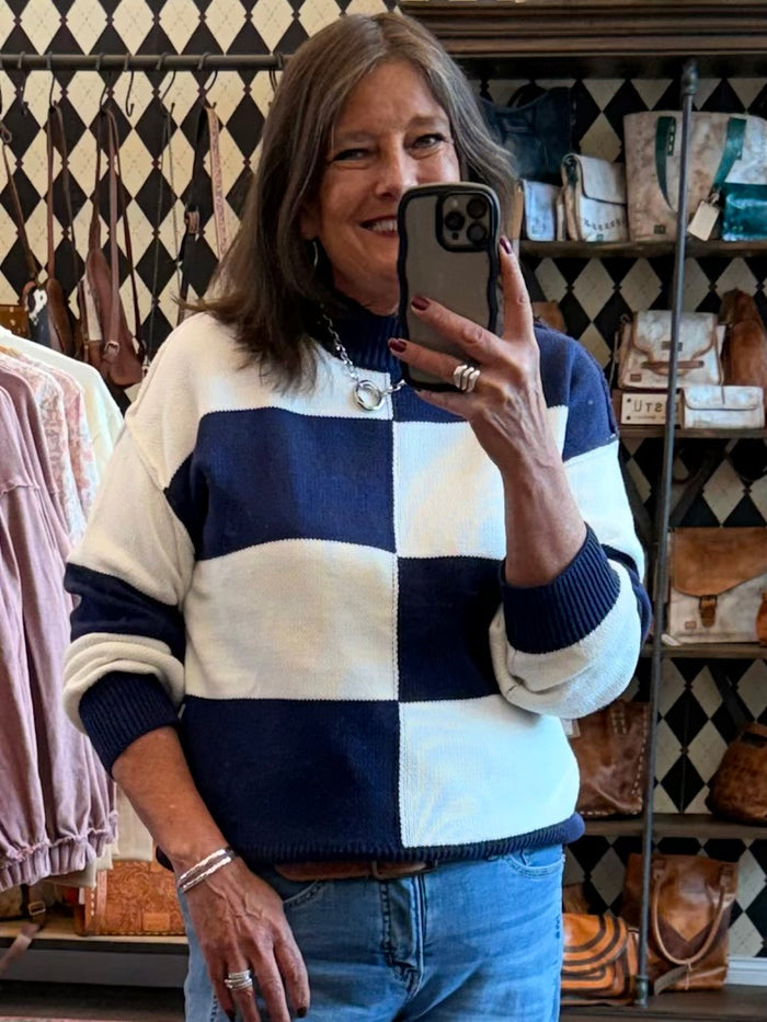 Mock neck checkered sweater in navy and cream, long sleeves, ribbed cuffs and hem