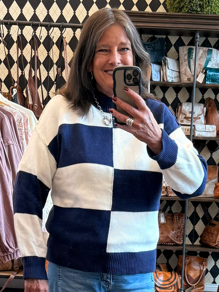 Mock neck checkered sweater in navy and cream, long sleeves, ribbed hem