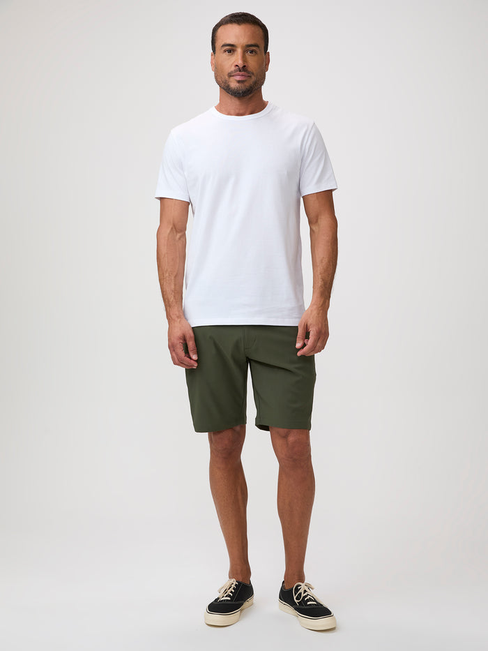 Stock the rotation. Done for the season. # man in olive green shorts, two inseams 7" and 9", 4-way stretch fabric, recycled polyester