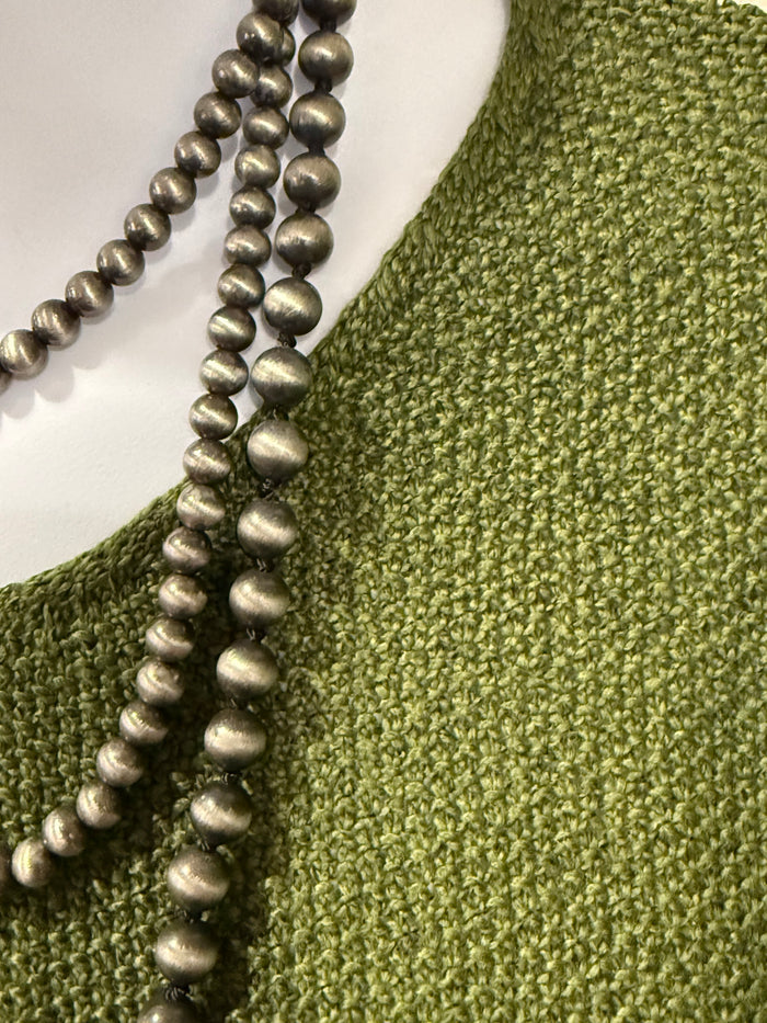 Olive V-neck short-sleeve seamed knit sweater, textured fabric detail at neckline