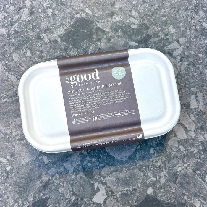 Container of 'The Good Farm Shop' chicken and mushroom pie on a gray surface