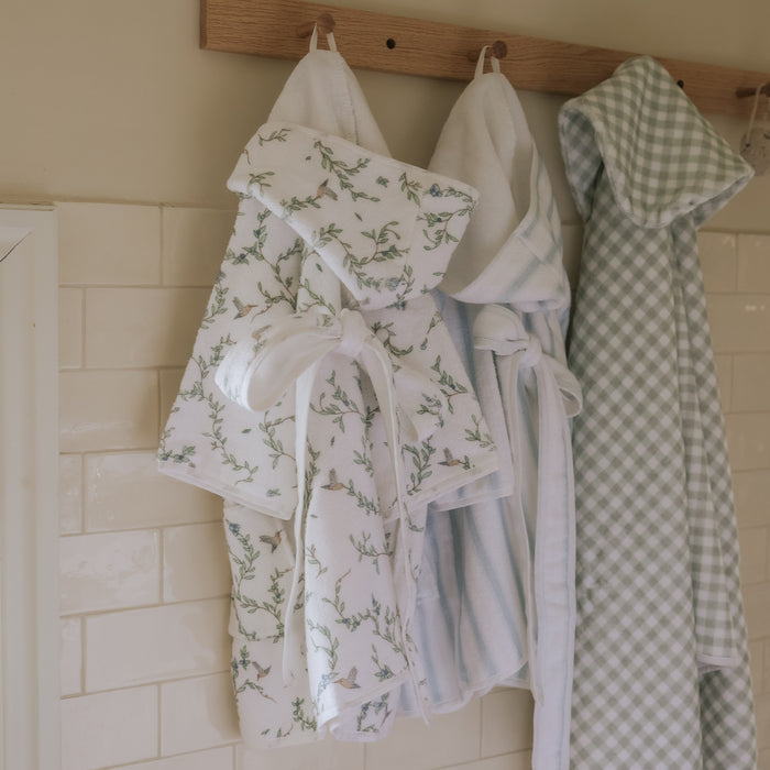 Hanging children's robes and towels