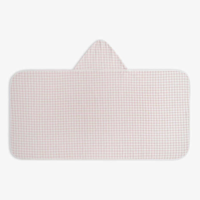 Checkered pink and white children's hooded towel on a white background