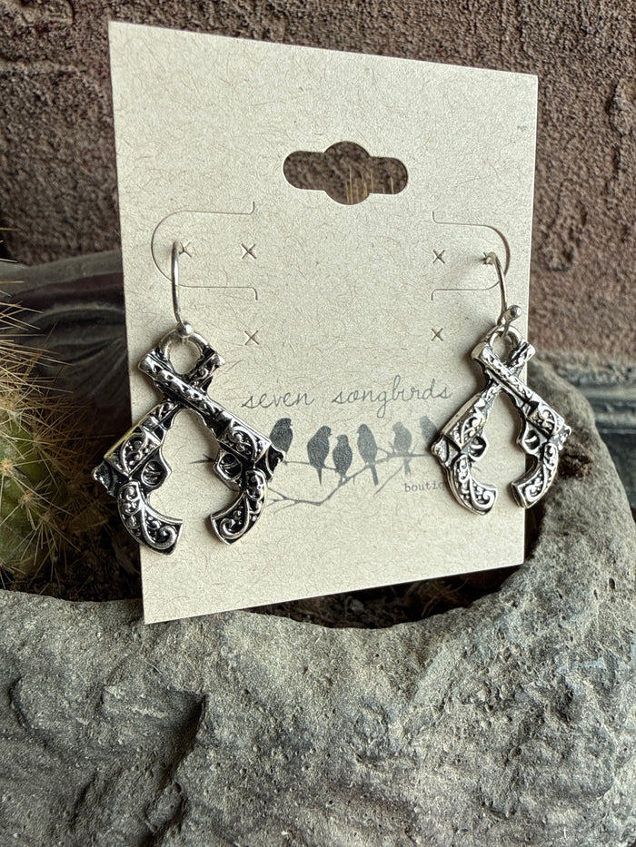 Silver-tone fishhook-style dangling earrings with ornate carved charm details