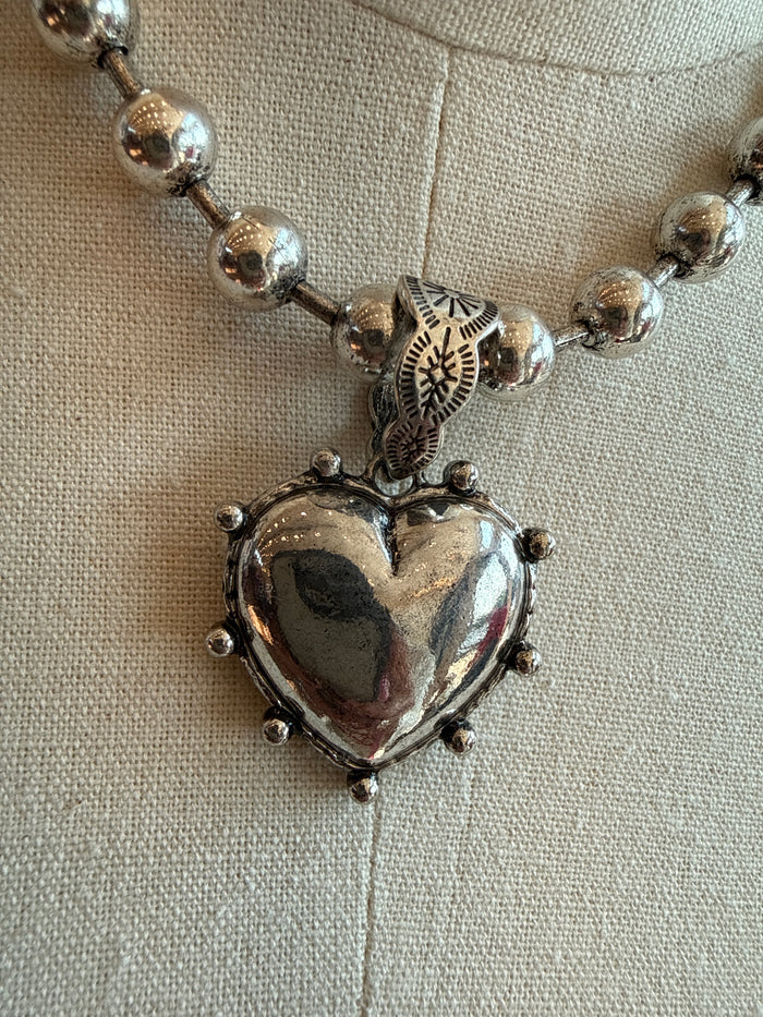 Silver-tone bead chain heart pendant with ornate etched frame and heart charm