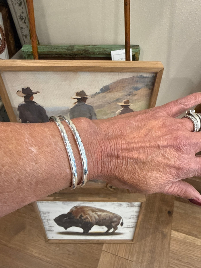 Silpada silver-tone cuff bracelet with three slim stacked bands on wrist