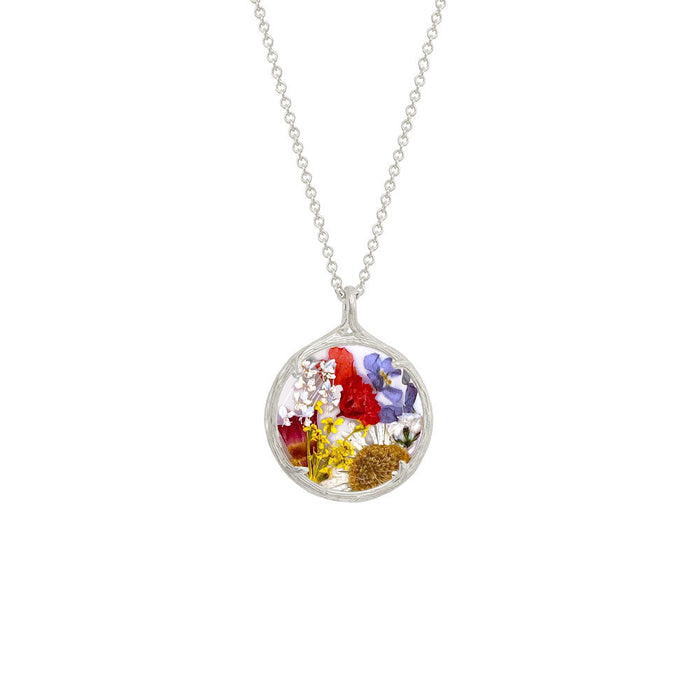 Small Botanical Necklace | Catherine Weitzman Jewelry featuring a delicate silver pendant encasing a colorful assortment of preserved flowers on a fine chain.