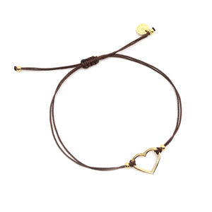 Spavia Gives Back Heart Cord Bracelet × 3 | Love You More featuring a delicate brown leather cord with a gold-tone open heart charm and adjustable sliding knot for a personalized fit.