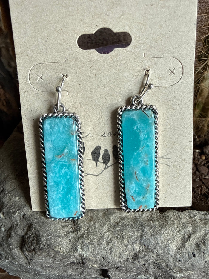 Stone fishhook earrings with rectangular turquoise cabochons and silver-tone frames