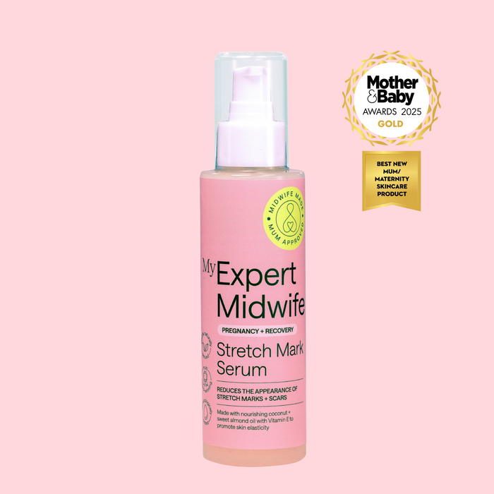 Pink bottle of My Expert Midwife Stretch Mark Serum with an award on a pink background