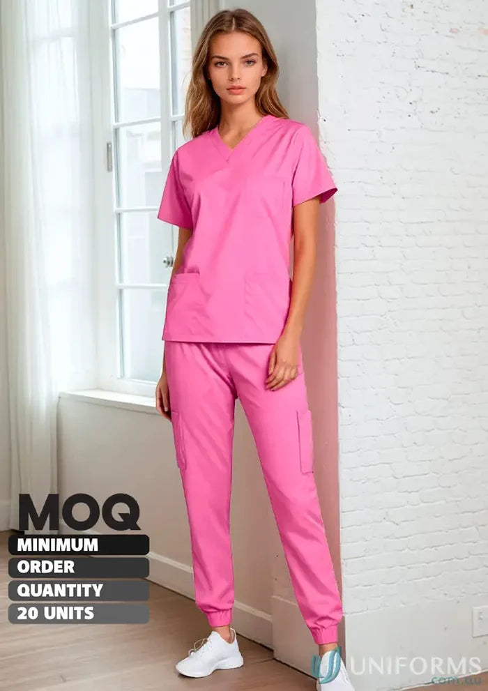 Pink women’s stretch jumper scrub set with 9-pocket jogger for comfortable workwear